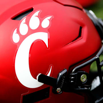 A Cincinnati Bearcats helmet lays on the turf during a spring practice at Nippert Stadium in Cincinnati on Thursday, March 24, 2022.

Cincinnati Bearcats Spring Practice