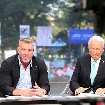 Host Pat McAfee, center, makes a point while Rece Davis, left, and Lee Corso look on during the ESPN College GameDay show on Saturday, Sept. 23, 2023, on the Hesburgh Library lawn on the University of Notre Dame campus in South Bend. The show was to highlight the Notre Dame-Ohio State game.