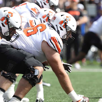 Sep 28, 2024; Manhattan, Kansas, USA; Oklahoma State Cowboys offensive lineman Joe Michalski (66) waits to snap the ball against the Kansas State Wildcats during the third quarter at Bill Snyder Family Football Stadium. Mandatory Credit: Scott Sewell-Imagn Images