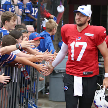 Josh Allen leads the QBs onto the field, high-fiving fans as they go, during day seven of Buffalo Bills training camp.