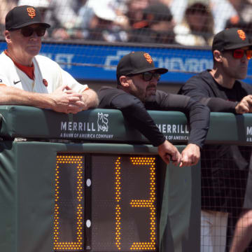 Jul 14, 2024; San Francisco, California, USA; San Francisco Giants manager Bob Melvin (left) watches the action during the second inning against the Minnesota Twins at Oracle Park.