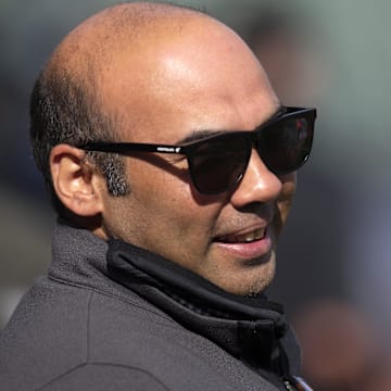 Oct 7, 2021; San Francisco, CA, USA; San Francisco Giants president of baseball operations Farhan Zaidi talks with a reporter during NLDS workouts.