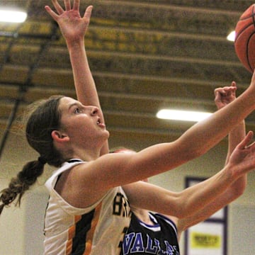 Rock Bridge's Mari Miller goes for a layup during the Class 6 District 7 championship game at Hickman High School.