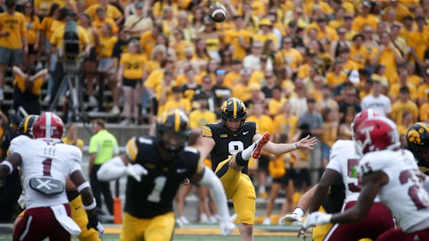 Iowa kick Rhys Dakin (9) punts against Troy Saturday, Sept. 14, 2024 at Kinnick Stadium in Iowa City, Iowa.