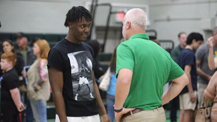 New Pensacola Catholic head football coach Bobby Clayton (right) speaks with Pensacola Catholic EDGE rusher Trenton Henderson (left) during a formal introduction on Sunday, Jan. 5, 2024.