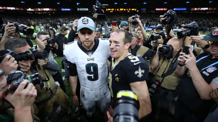 Jan 13, 2019; New Orleans, LA, USA; Philadelphia Eagles quarterback Nick Foles (9) and New Orleans Saints quarterback Drew Brees (9) meet after a NFC Divisional playoff football game at Mercedes-Benz Superdome. The Saints won 20-14. Mandatory Credit: Chuck Cook-USA TODAY Sports