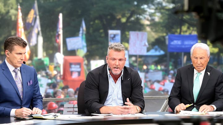 Host Pat McAfee, center, makes a point while Rece Davis, left, and Lee Corso look on during the ESPN College GameDay show on Saturday, Sept. 23, 2023, on the Hesburgh Library lawn on the University of Notre Dame campus in South Bend. The show was to highlight the Notre Dame-Ohio State game.