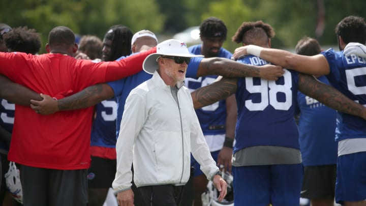 Bills head coach Sean McDermott walks off the practice field as his players huddle up after the final Buffalo Bills training camp session.