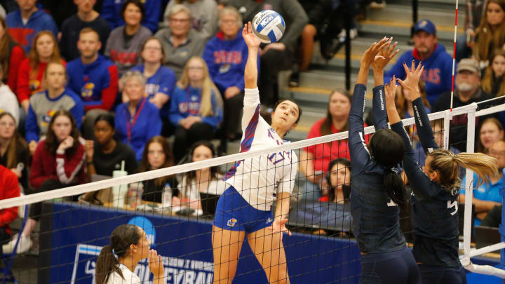 Kansas junior outside hitter Ayah Elnady (17) hits the ball back to Penn State during Friday's NCAA D1 Volleyball Second Round inside Horejsi Family Volleyball Arena.