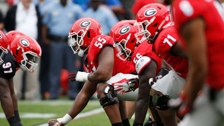 Georgia offensive lineman Jared Wilson (55) gets set to snap the ball during the G-Day spring football game in Athens, Ga., on Saturday, April 16, 2022. The black team won 26-23.

Syndication Online Athens