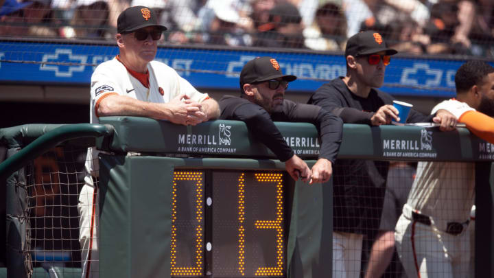 Jul 14, 2024; San Francisco, California, USA; San Francisco Giants manager Bob Melvin (left) watches the action during the second inning against the Minnesota Twins at Oracle Park.