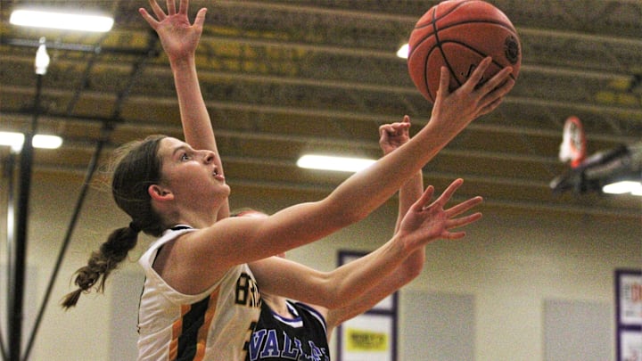 Rock Bridge's Mari Miller goes for a layup during the Class 6 District 7 championship game at Hickman High School. Rock Bridge's Mari Miller goes for a layup during the Class 6 District 7 championship game at Hickman High School.