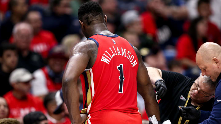 Apr 16, 2024; New Orleans, Louisiana, USA; New Orleans Pelicans forward Zion Williamson (1) gets medical attention during the first half against the Los Angeles Lakers in a play-in game of the 2024 NBA playoffs against the New Orleans Pelicans at Smoothie King Center.