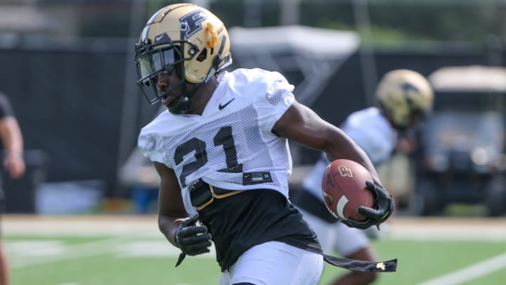 Purdue Boilermaker defensive back Sanoussi Kane (21) runs a drill during Purdue football practice,