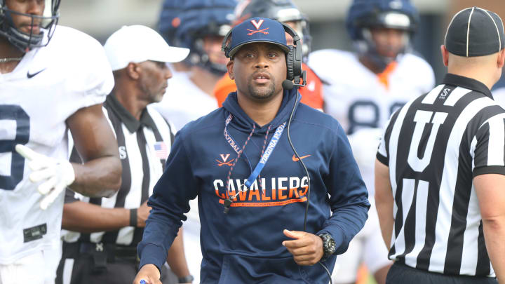 Notes and observations from the first week of Virginia football fall camp practices, including quotes from UVA head coach Tony Elliott and offensive coordinator Des Kitchings.