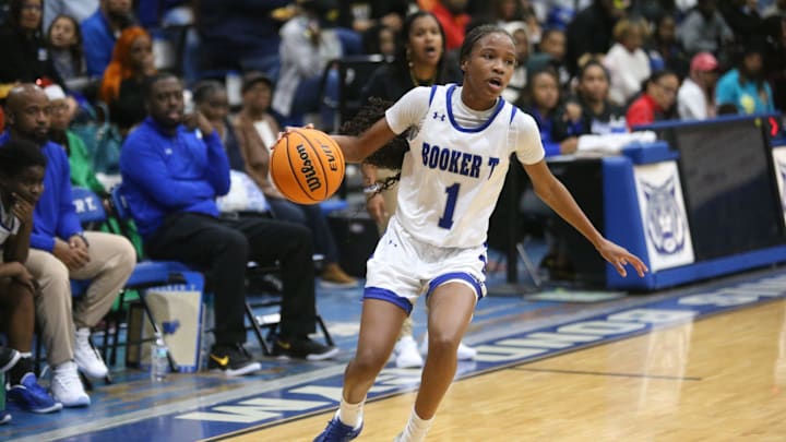 Booker T. Washington's Jada Clardy (1) surveys the court during the Pine Forest at Booker T. Washington girls basketball game on Friday, Dec. 13, 2024.
