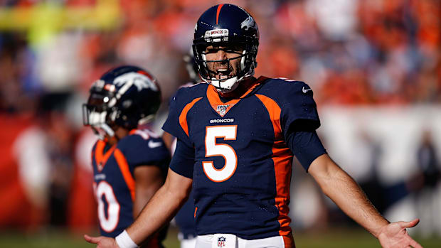 Denver Broncos quarterback Joe Flacco (5) reacts after a call in the second quarter against the Tennessee Titans.