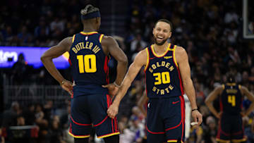 Mar 13, 2025; San Francisco, California, USA; Golden State Warriors forward Jimmy Butler III (10) and guard Stephen Curry (30) share a laugh during the second quarter against the Sacramento Kings at Chase Center. Mandatory Credit: D. Ross Cameron-Imagn Images
