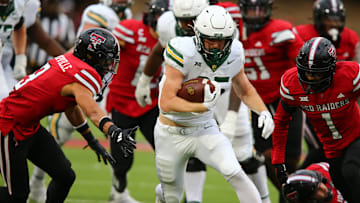 Oct 19, 2024; Lubbock, Texas, USA;  Baylor Bears running back Dawson Pendergrass (35) runs the ball against the Texas Tech Red Raiders in the second half at Jones AT&T Stadium and Cody Campbell Field. Mandatory Credit: Michael C. Johnson-Imagn Images