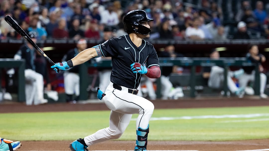May 5, 2025; Phoenix, Arizona, USA; Arizona Diamondbacks outfielder Corbin Carroll hits a home run in the first inning against the New York Mets at Chase Field. Mandatory Credit: Mark J. Rebilas-Imagn Images