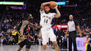 Mar 28, 2023; San Francisco, California, USA; New Orleans Pelicans small forward Brandon Ingram (14) controls the ball against Golden State Warriors center Draymond Green (23) during the fourth quarter at Chase Center. 