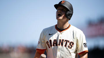Jul 13, 2025; San Francisco, California, USA; San Francisco Giants third baseman Matt Chapman (26) reacts to striking out against the Los Angeles Dodgers during the 11th inning at Oracle Park. 