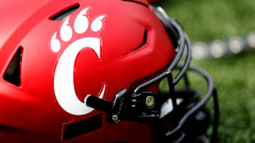 A Cincinnati Bearcats helmet lies on the turf during a spring practice at Nippert Stadium in Cincinnati.