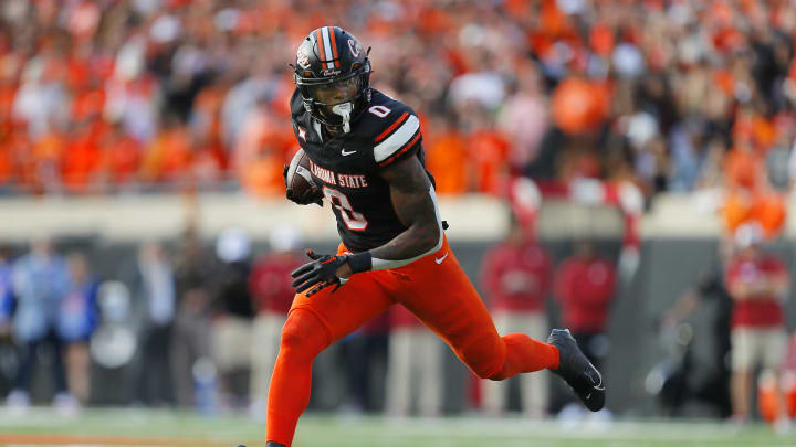 Running back Ollie Gordon II #0 of the Oklahoma State Cowboys carries the ball against the Oklahoma Sooners in the third quarter of Bedlam at Boone Pickens Stadium on November 4, 2023 in Stillwater, Oklahoma. Oklahoma State won 27-24. 