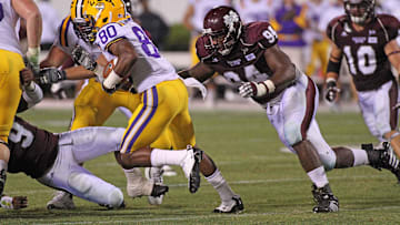Sep 15, 2011; Starkville, MS, USA; Mississippi State Bulldogs defensive lineman Fletcher Cox (94) pursues Louisiana State Tigers wide receiver Jarvis Landry (80) during the second half at Davis Wade Stadium.  Louisiana State defeat Mississippi State 19-6.  Mandatory Credit: Spruce Derden-Imagn Images