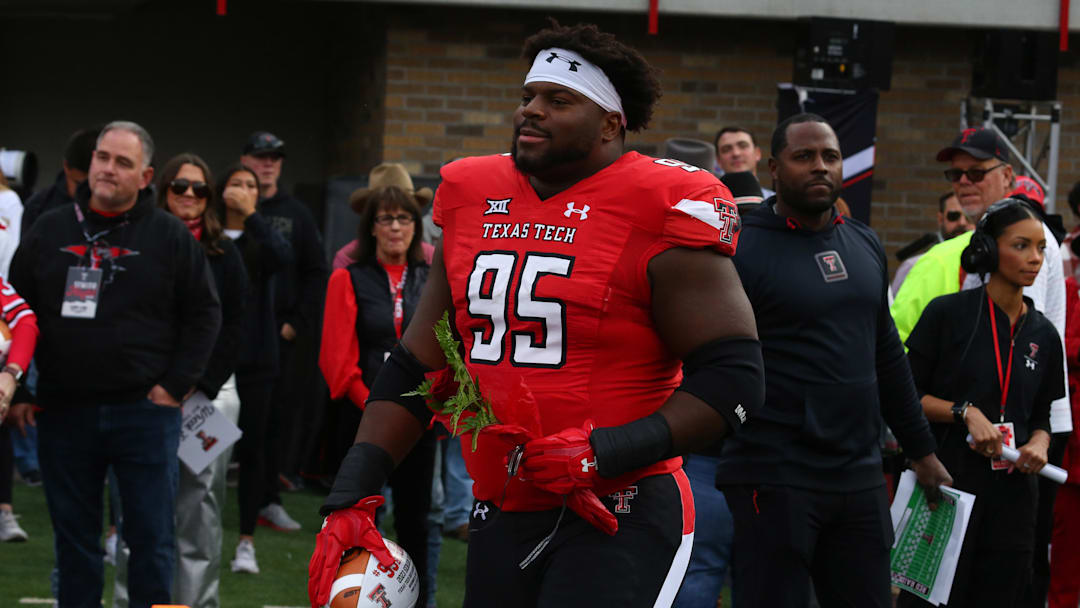 Nov 18, 2023; Lubbock, Texas, USA;  Texas Tech Red Raiders senior defensive tackle Jaylon Hutchings (95) enters the field during senior night before the game against the Central Florida Knights at Jones AT&T Stadium and Cody Campbell Field.