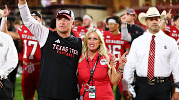 Aug 30, 2025; Lubbock, Texas, USA;  Texas Tech Red Raiders head coach Joey McGuire and wife Debbie sing the school song after the game against the Arkansas-Pine Bluff Golden Lions at Jones AT&T Stadium. Mandatory Credit: Michael C. Johnson-Imagn Images
