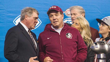 Dec 6, 2014; Charlotte, NC, USA; Florida State Seminoles head coach Jimbo Fisher talks with ACC commissioner John Swofford after defeating the Georgia Tech Yellow Jackets in the ACC Championship game at Bank of America Stadium. FSU defeated Georgia Tech 37-35. Mandatory Credit: Jeremy Brevard-Imagn Images