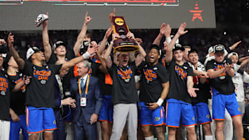Florida Gators players hoist the trophy after defeating the Houston Cougars in the national championship game of the 2025 NCAA Tournament at the Alamodome. 