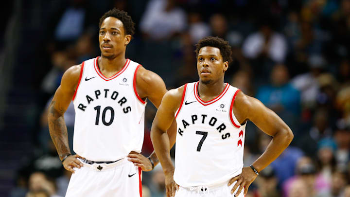 Feb 11, 2018; Charlotte, NC, USA; Toronto Raptors guard Kyle Lowry (7) and guard DeMar DeRozan (10) stands on the court in the first half against the Charlotte Hornets at Spectrum Center. Mandatory Credit: Jeremy Brevard-Imagn Images