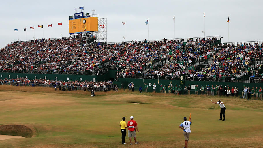 Phil Mickelson reacts to a birdie putt on the 18th hole during the final round of the 2013 British Open.