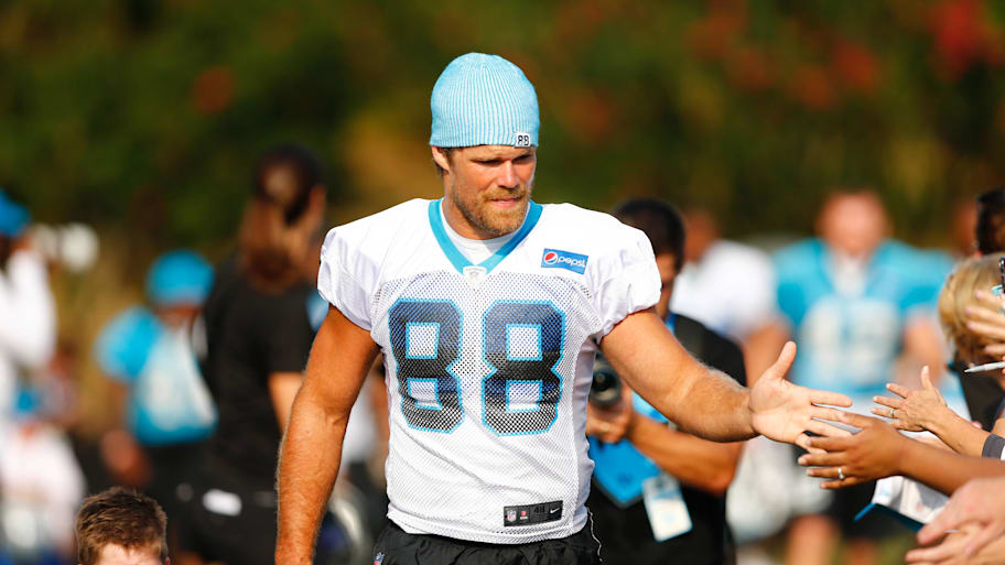 Carolina Panthers tight end Greg Olsen walks to the field during training camp held at Wofford College.