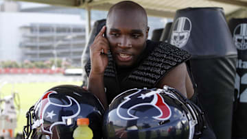 Houston Texans head coach DeMeco Ryans (59) talks on the phone during training camp at Methodist Training Center.