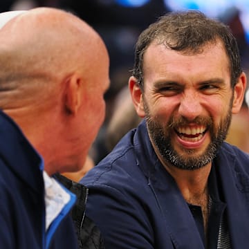 Jan 5, 2025; San Francisco, California, USA; Retired NFL quarterback Andrew Luck smiles on the sideline during the third quarter of the game between the Golden State Warriors and Sacramento Kings at Chase Center. Mandatory Credit: Kelley L Cox-Imagn Images