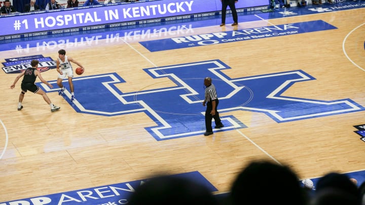 Kentucky-commit Reed Sheppard brings the ball up the court atop the large UK logo at the UK HealthCare Boys Sweet 16 tournament Wednesday at Rupp Arena. March 15, 2022

2022 Sweet Sixteen Boys Basketball Tournament