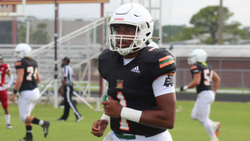 Tramell Jones trots off the field during a jamboree with Mandarin, St. Augustine and Bishop Kenny on Wednesday.