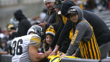 Iowa Hawkeyes linebacker Jayden Montgomery signs autographs for fans during an open spring practice Saturday, April 20, 2024 at Kinnick Stadium in Iowa City, Iowa.