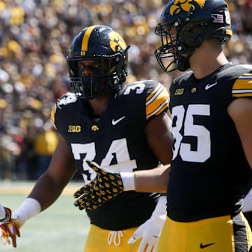 Iowa State’s Darien Porter (10) shakes hands with Iow’s Jay Higgins (34) and Luke Lachey (85) after the coin toss at the CyHawk game Saturday, Sept. 7, 2024 at Kinnick Stadium in Iowa City, Iowa.