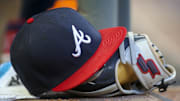 May 31, 2019; Atlanta, GA, USA; Detailed view of hat and glove of Atlanta Braves center fielder Ronald Acuna Jr. (not pictured) against the Detroit Tigers in the fourth inning at SunTrust Park. Mandatory Credit: Brett Davis-Imagn Images
