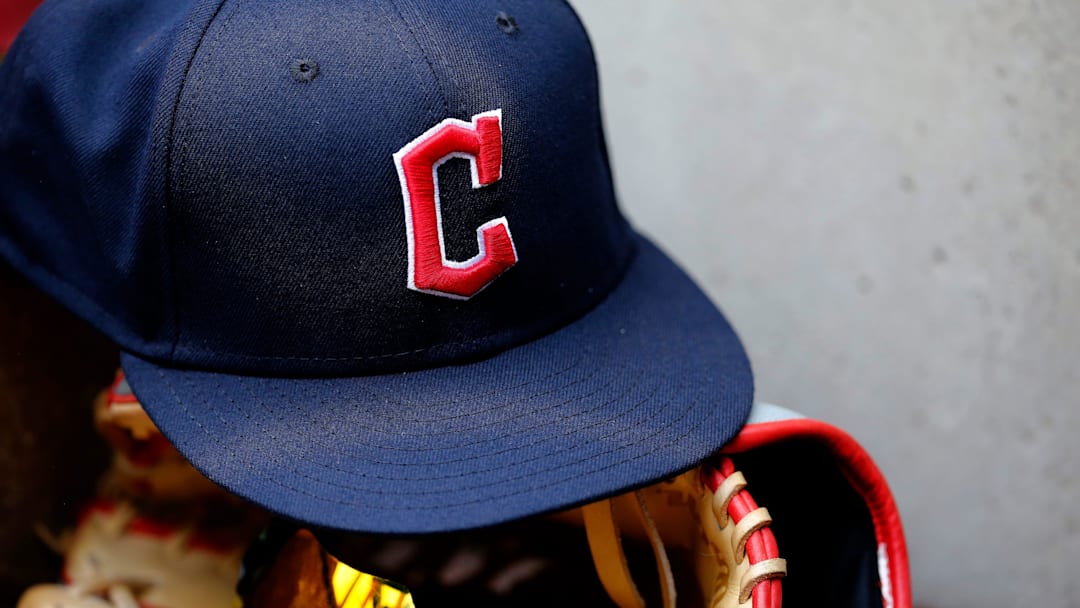 A ball cap sports the Cleveland Guardians logo in the third inning of the MLB Inter-league game between the Cincinnati Reds and the Cleveland Guardians at Great American Ball Park in downtown Cincinnati.