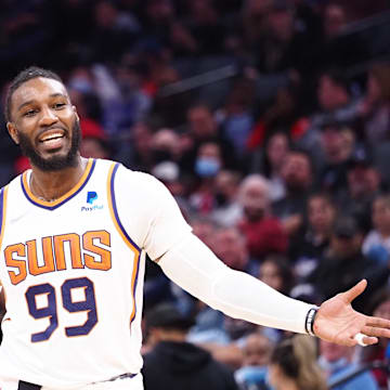 Nov 8, 2021; Sacramento, California, USA; Phoenix Suns forward Jae Crowder (99) reacts to the foul call as Sacramento Kings forward Richaun Holmes (22) takes a free throw during the second quarter at Golden 1 Center. 