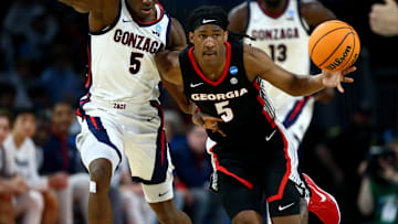 Mar 20, 2025; Wichita, KS, USA; Georgia Bulldogs guard Silas Demary Jr. (5) dribbles against Gonzaga Bulldogs forward Emmanuel Innocenti (5) in the second half of a first round men’s NCAA Tournament game at Intrust Bank Arena. Mandatory Credit: Nick Tre. Smith-Imagn Images