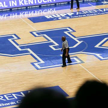 Kentucky-commit Reed Sheppard brings the ball up the court atop the large UK logo at the UK HealthCare Boys Sweet 16 tournament Wednesday at Rupp Arena. March 15, 2022

2022 Sweet Sixteen Boys Basketball Tournament