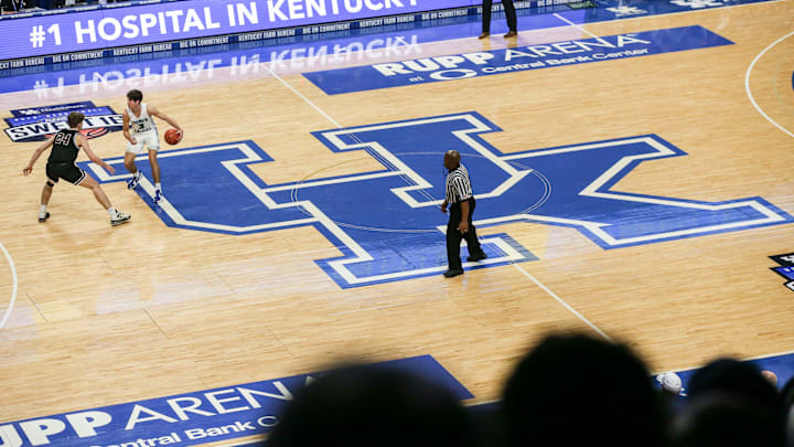 Kentucky-commit Reed Sheppard brings the ball up the court atop the large UK logo at the UK HealthCare Boys Sweet 16 tournament Wednesday at Rupp Arena. March 15, 2022

2022 Sweet Sixteen Boys Basketball Tournament