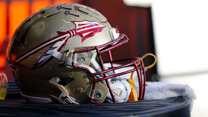 Nov 25, 2017; Gainesville, FL, USA; Florida State Seminoles helmet lays on the field against the Florida Gators during the second half at Ben Hill Griffin Stadium. Mandatory Credit: Kim Klement-Imagn Images Nov 25, 2017; Gainesville, FL, USA; Florida State Seminoles helmet lays on the field against the Florida Gators during the second half at Ben Hill Griffin Stadium. Mandatory Credit: Kim Klement-Imagn Images