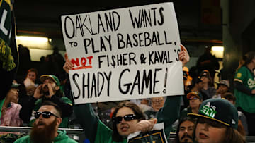 Apr 28, 2023; Oakland, California, USA; An Oakland Athletics fan holds a sign in reference to owner John Fisher and president Dave Kaval (not pictured) during the sixth inning against the Cincinnati Reds at Oakland Coliseum. Mandatory Credit: Kelley L Cox-Imagn Images